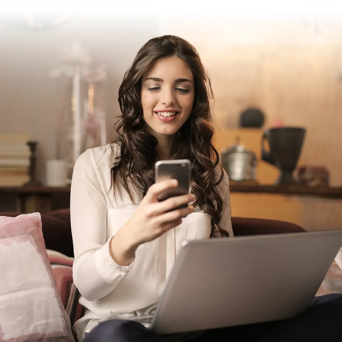 happy woman buying bitcoin on her smartphone