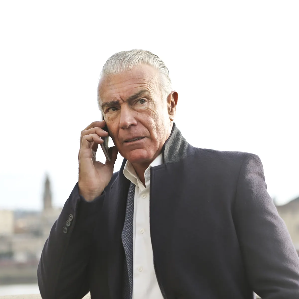 serious looking man buying bitcoin with his smartphone